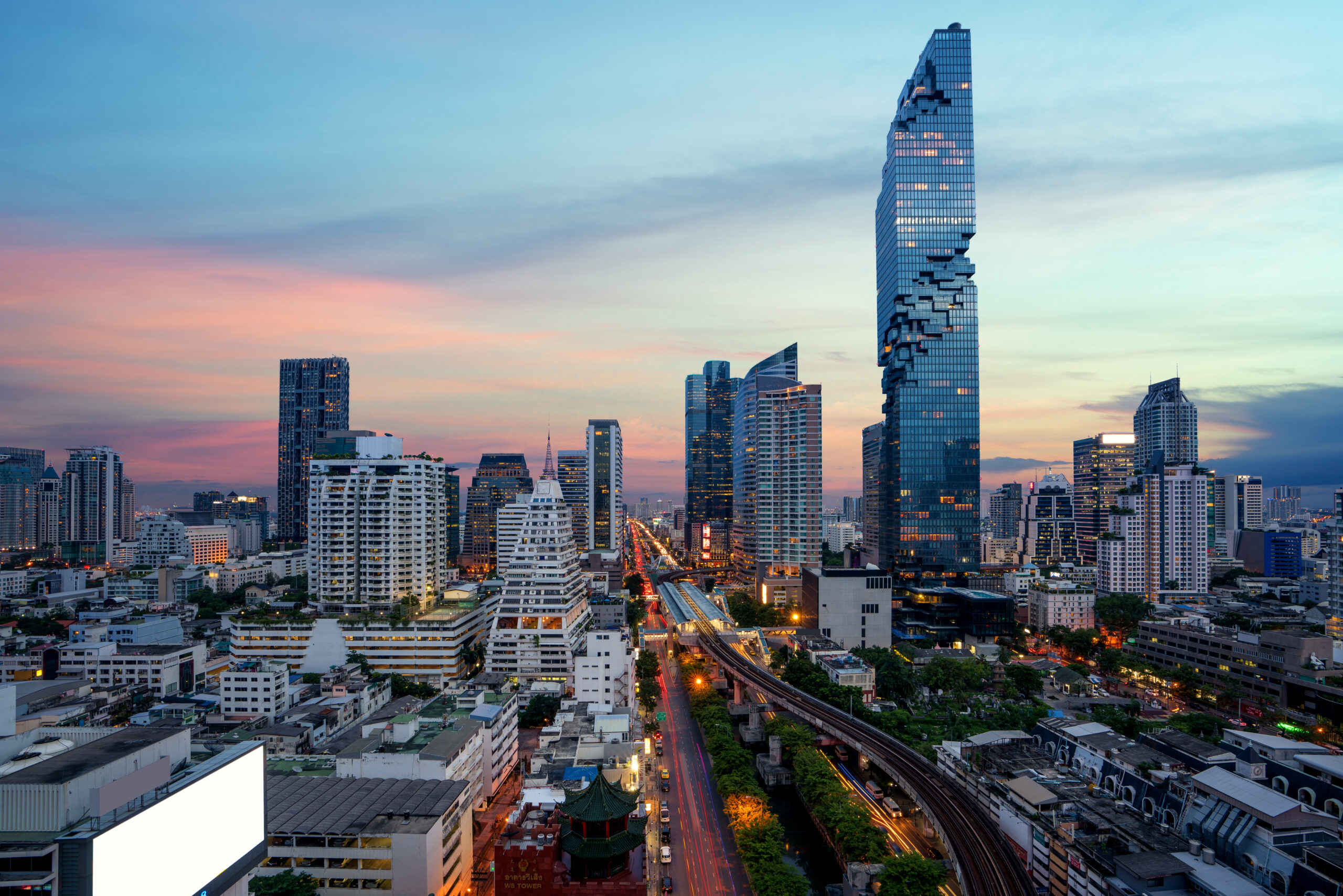 Bangkok Transportation at Dusk with Modern Business Building from top view in Bangkok, Thailand.